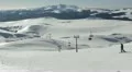 Snow Covered Alpine Background Frozen Sunny Winter Sports Skiers Practicing Alps HD Footage