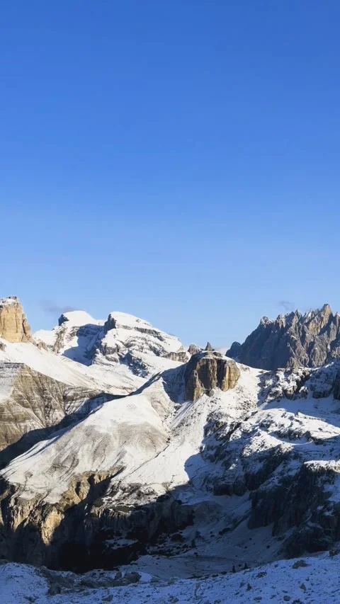 Snow covered alpine valley landscape in Dolomites mountains Stock Footage 330437405
