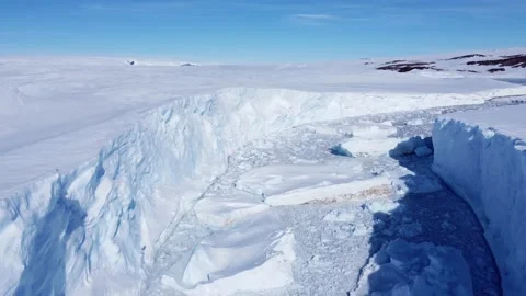 Snow covered antarctic surface aerial view flight. Stock Footage 219754046