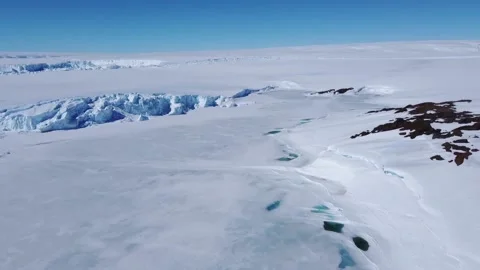 Snow covered antarctic surface aerial view flight. Stock Footage 224493696