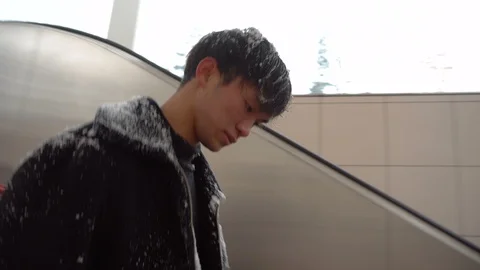 Snow Covered Asian Man Walking Down Entrance to Subway Station - Sapporo Stock Footage 101055159