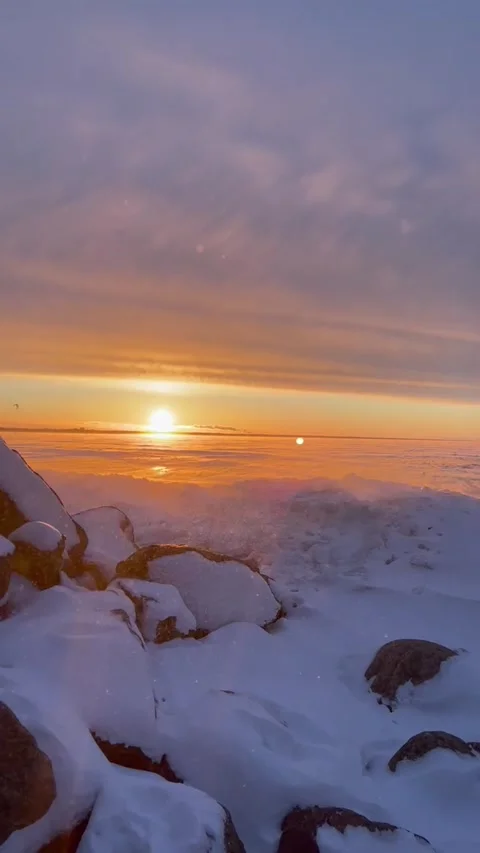 Snow-covered Baltic coast on a winter day at sunset Stock Footage 227412428