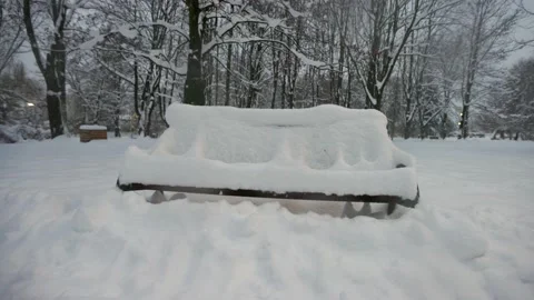 Snow-covered bench in the park Stock-Footage 228753523