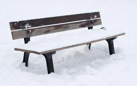 Snow covered bench Stock Photos