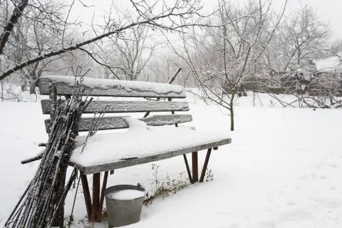 Snow-covered bench Stock Photos