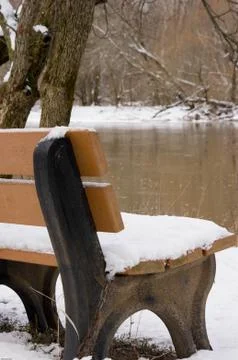 Snow covered bench Stock Photos
