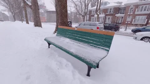 Snow covered bench in winter city park Stock Footage 323972503
