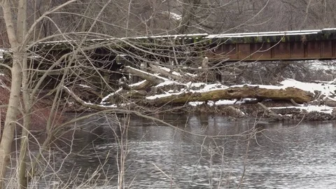 Snow covered bridge over river Stock Footage 72602269