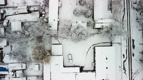 Snow-covered buildings top view 4k Stock Footage 167668610