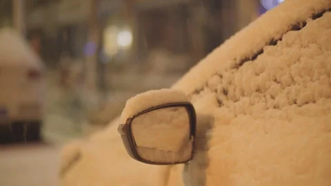 Snow Covered Car Side Mirror Close-up at Night in Winter Video stock 339066744