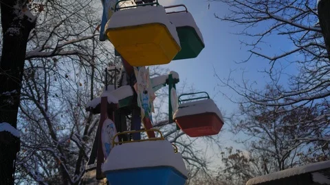 Snow Covered Carousel Illuminated by the Setting Sun Stock Footage 101760015