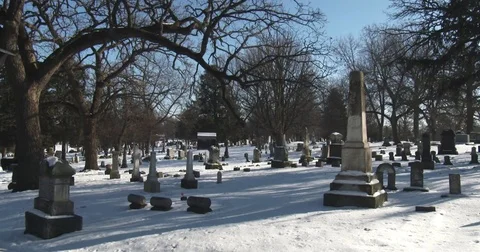 Snow Covered Cemetery with Trees Stock Footage 84247368