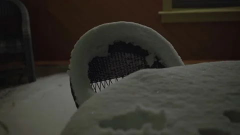 Snow-covered chairs in the yard Stock Footage 232419323
