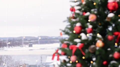 Snow-covered Christmas tree with decor on the background of a winter landscape. Stock Footage 165580726