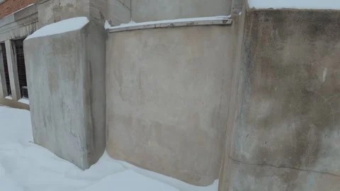 Snow Covered Concrete Wall in Winter City Stock Footage 323486568