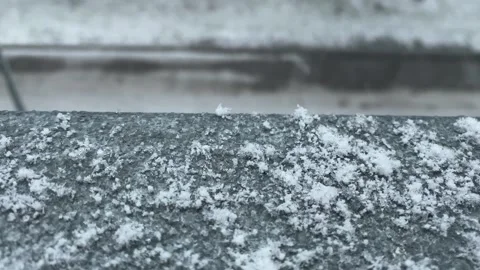 Snow-covered cornice. It's snowing outside. Snowflakes on the cornice. 動画素材 262046664