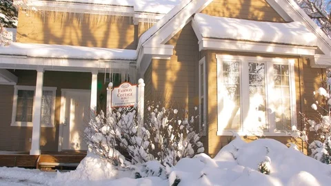 Snow covered cottage close up pan Stock-Footage 104296437