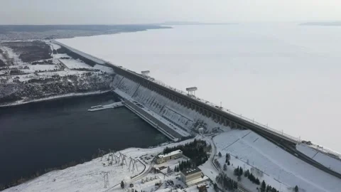 Snow covered dam and river captured in winter, Dam operation in winter. Stock Footage 299718035