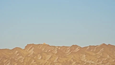 Snow-Covered Danxia Mountains Distant Peaks Sunset B-Roll Stock Footage 325863583