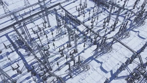 Snow covered electrical high voltage substation. Stock Footage 235346039