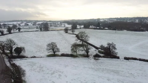 Snow Covered Fields Countryside Scene 2.7k Stock Footage 148039178