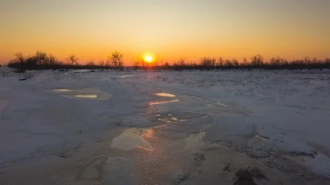 Snow-covered fields at sunset from a bird's eye view Stock Footage 123101578