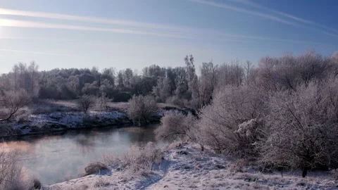 Snow-covered forest and river aerial photography Stock Footage 167721471