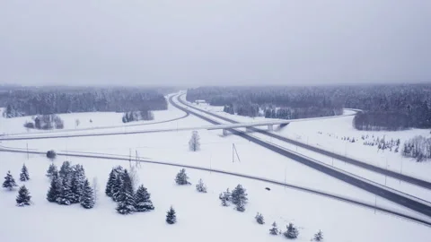 The snow covered ground with the long road Stock Footage 149546871