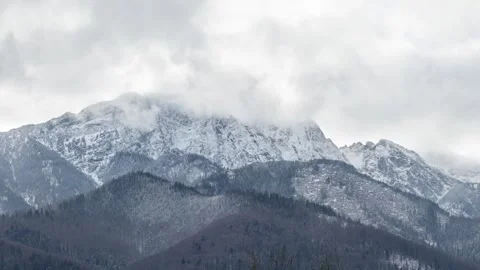 Snow-covered high steep peaks of the Tatra Mountains Stock Footage 296706223