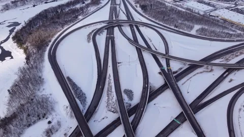 Snow covered highway interchange aerial winter traffic scene Stock Footage 328963089