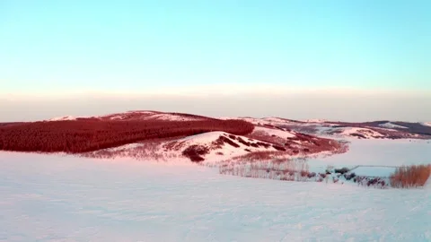 Snow Covered Hills and Forest in Warm Winter Light Vídeo Stock 344953242