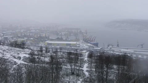 Snow-covered hillside on the background of the gulf and port. Stock Footage 143215334