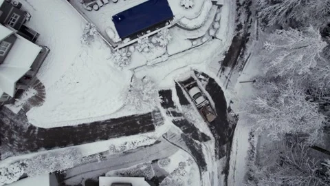 Snow covered homes and trees in quiet suburban neighborhood, winter wonderland Stock Footage 230194694