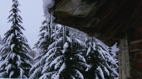 Snow covered house on mountain during snowfall 스톡 동영상 64861013