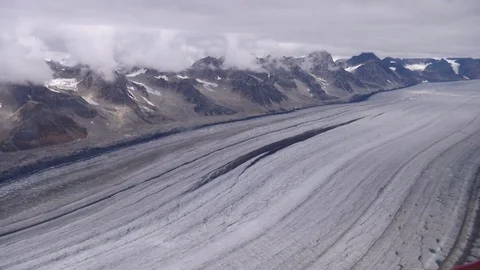 Snow covered landscape between rocky mountain during winter Stock Footage 100172213