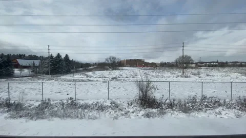 Snow Covered Landscape from a moving Train window Stock Footage