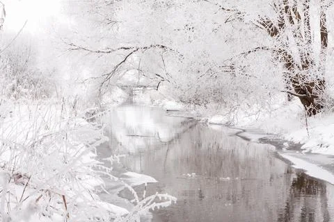 Snow-covered landscape of open spaces near the river. Snowy weather Fotos Stock