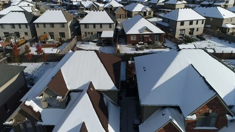 Snow Covered Mansions Towards Middleclass Houses Rooftops Aerial Flyover Video stock 122211296