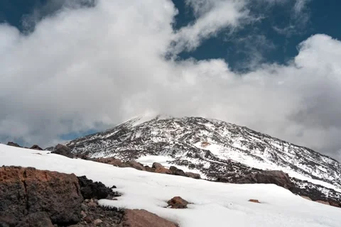 Snow-Covered Mount Teide with Clouds Moving Across Volcanic Landscape, Tenerife Stock Footage 345678971