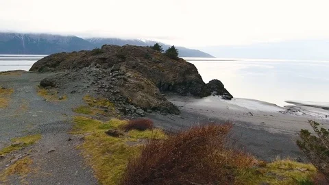 Snow covered mountain and sandy coast along the river during winter 스톡 동영상 79645854