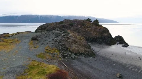Snow covered mountain and sandy coast along the river during winter Stock-Footage 79722703