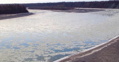 Snow covered mountain and sandy coast along the river during winter Stock-Footage 79878103