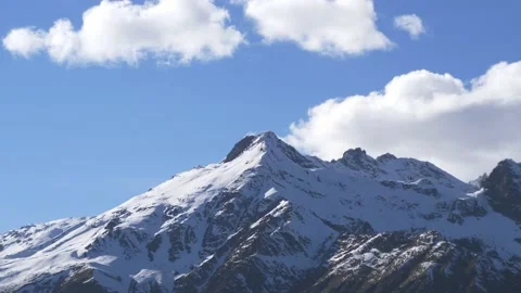 Snow covered mountain with clouds in the foreground, close-up Stock-Footage 190708066