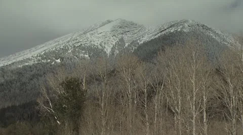 Snow Covered Mountain with A Cloudy Sky Backdrop 2 Video stock 19004591