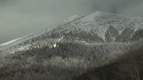 Snow Covered Mountain with A Cloudy Sky Backdrop Stock-Footage 19011844