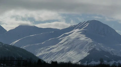 Snow Covered Mountain with Passing Clouds Stock Footage 38060271