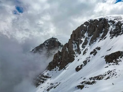 Snow-Covered Mountain Peak Dramatic Clouds Aerial Greece Stock Photos