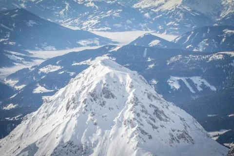 Snow covered mountain peak Stock Photos