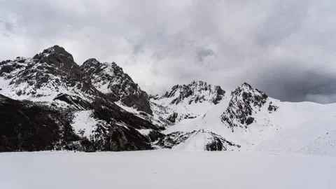 Snow-Covered Mountain Peaks Timelapse at Qizanggou, Sichuan, China Stock Footage 338308965