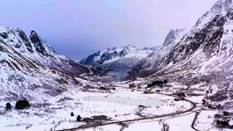 Snow covered mountain peaks under clear blue sky Stock Footage 340962500